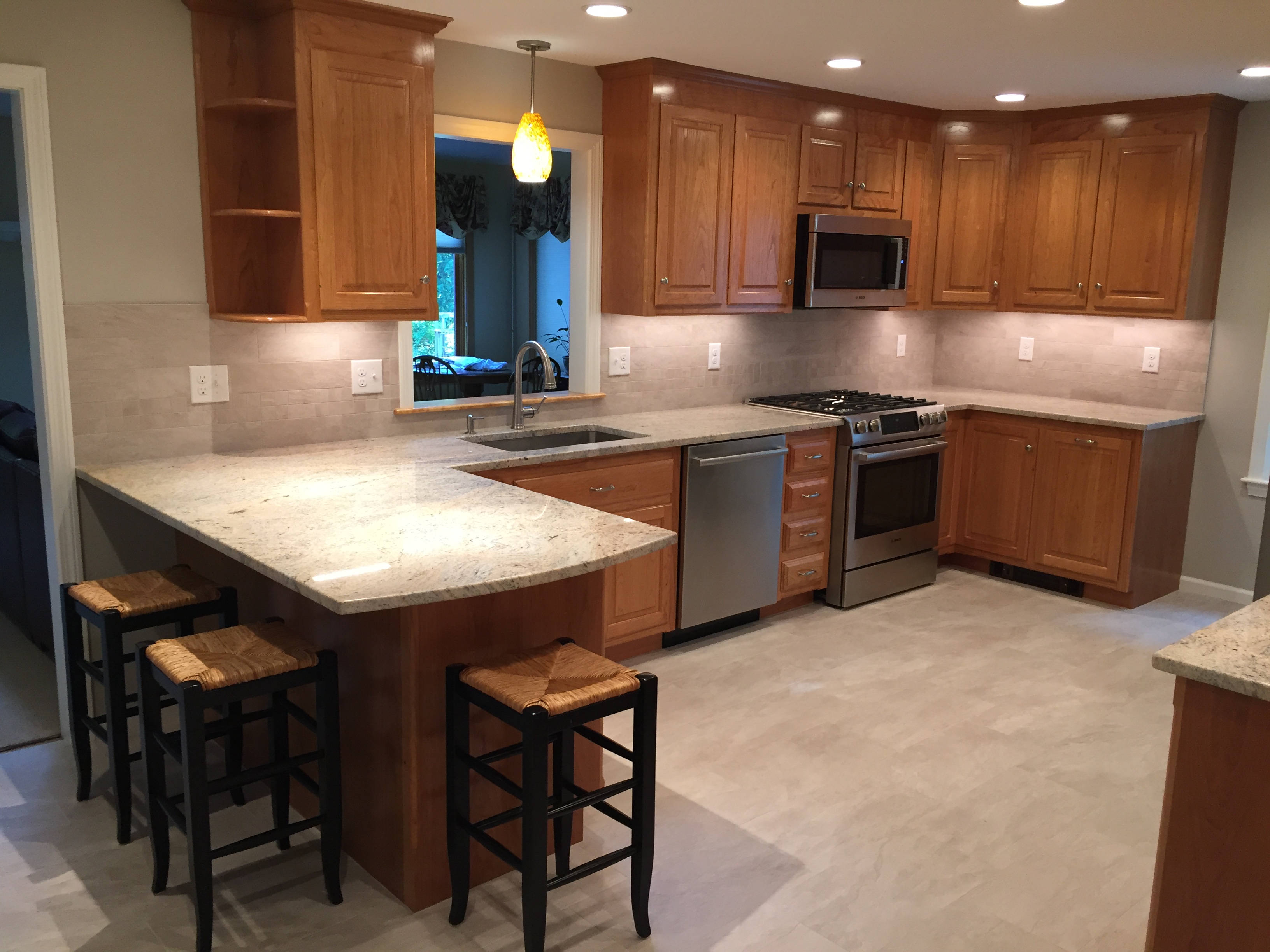 Kitchen w/ Wood Cabinets, Stainless Appliances and Granite Countertops